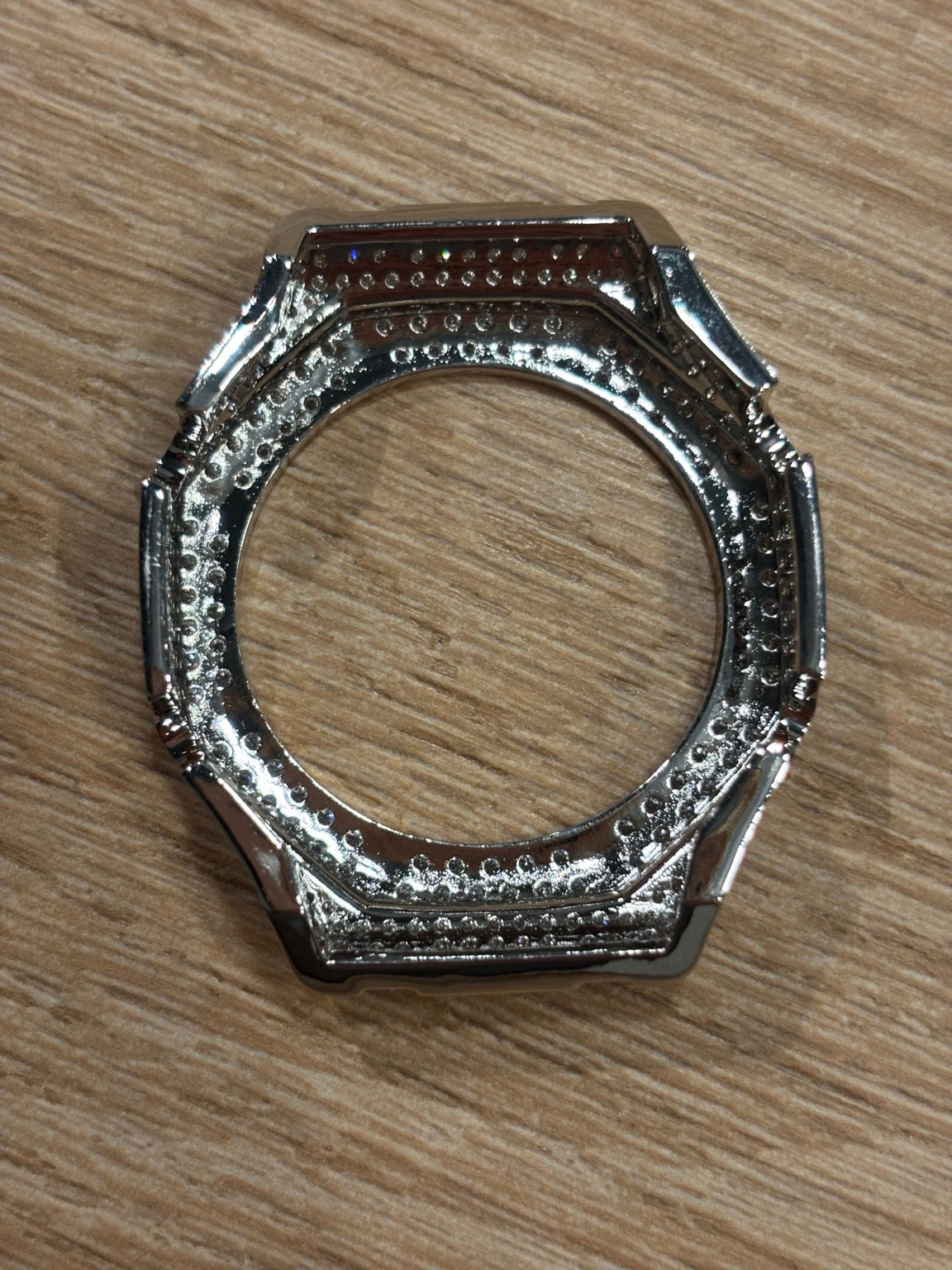 Back view of the silver-tone moissanite GA-2100 bezel cover