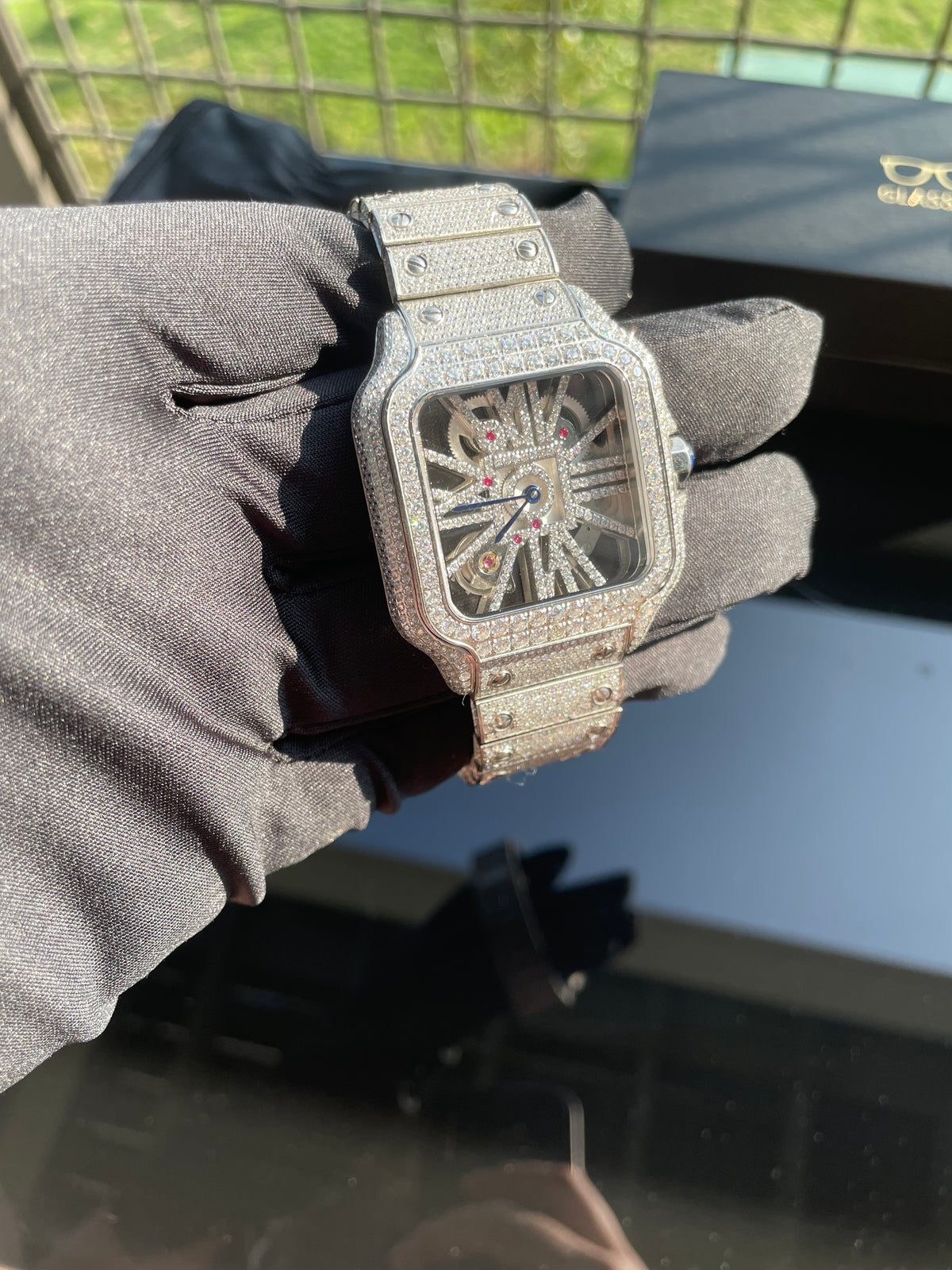 Front view of the full moissanite skeleton-style quartz watch