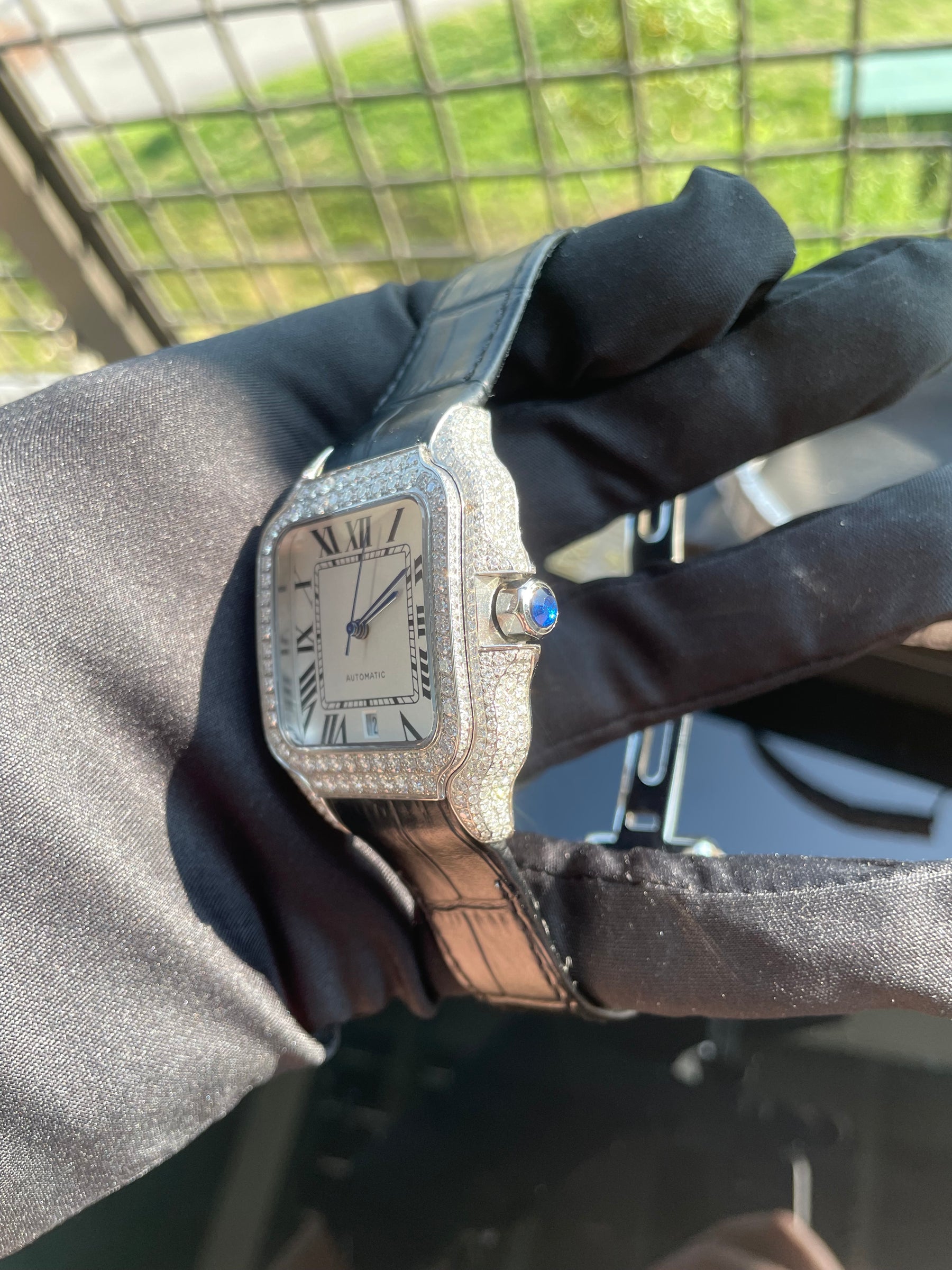 Side view of the automatic watch showing the blue crown accent
