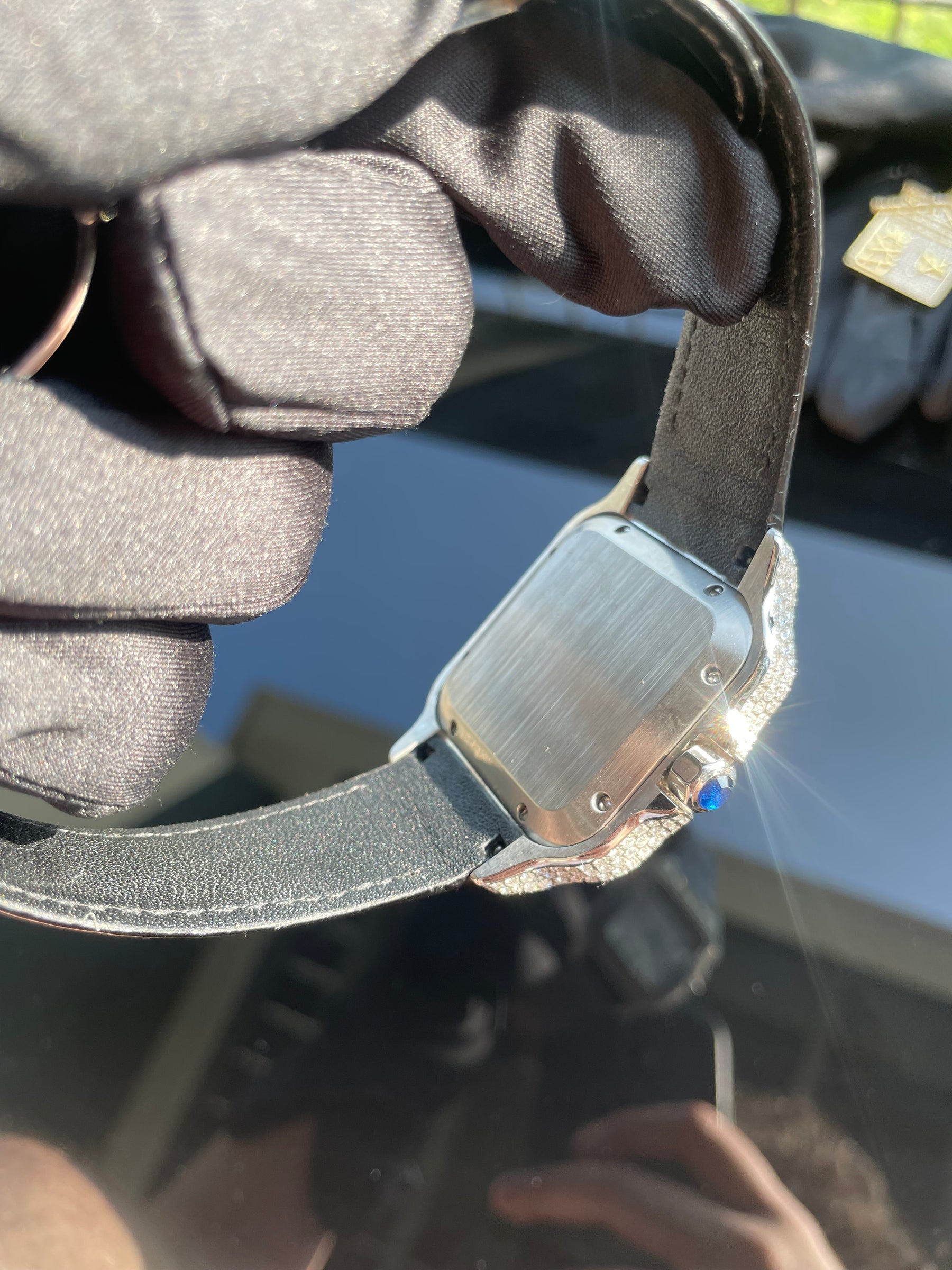 Stainless-steel caseback and black leather strap on the automatic watch