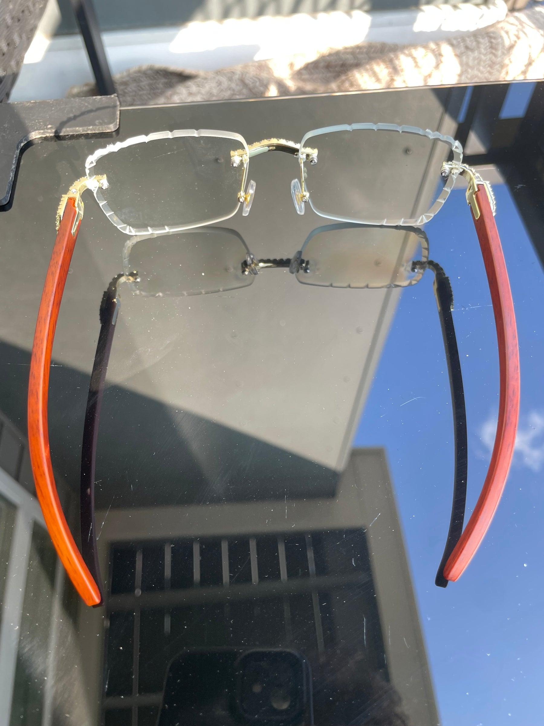 Rear view of S925 moissanite rimless glasses with temples open