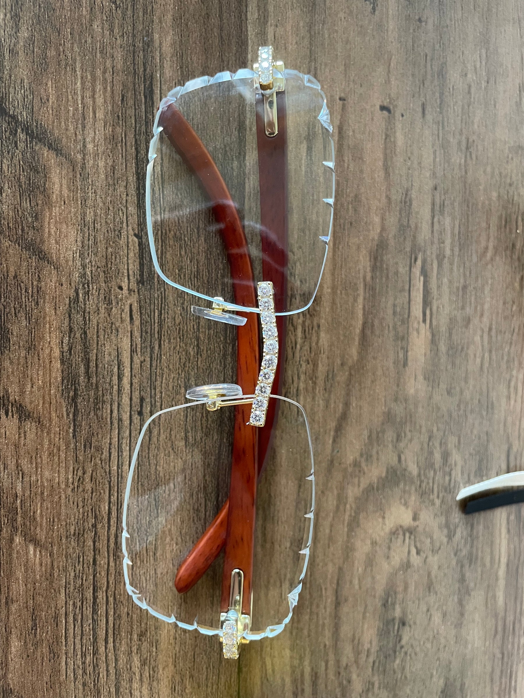 Front view of hand-set moissanite rimless glasses with clear geometric lenses